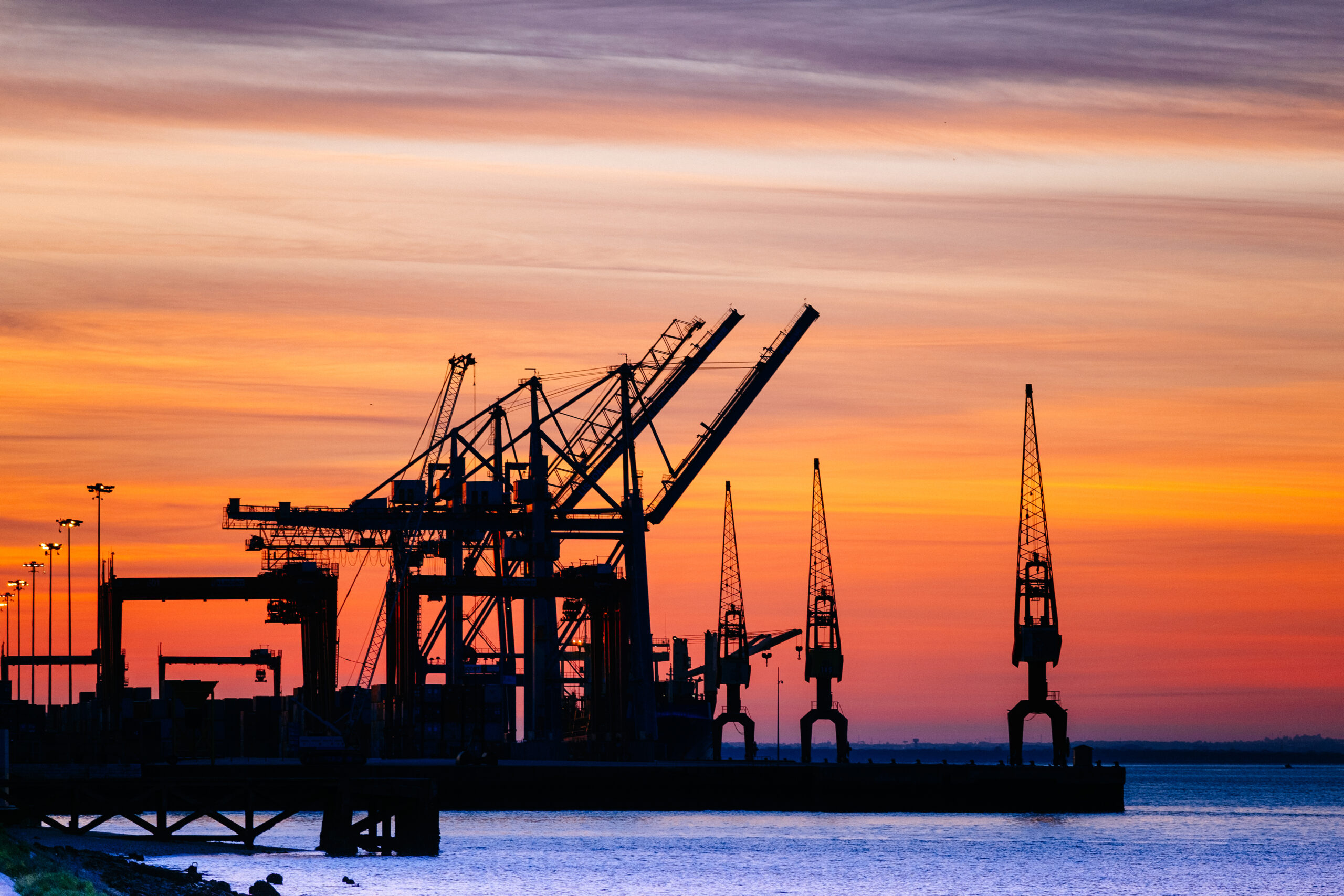 beautiful silhouette port machinery sunset 1 scaled